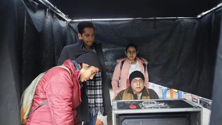 Arindam, Parambrata and other crew members check a scene on the monitor. 
