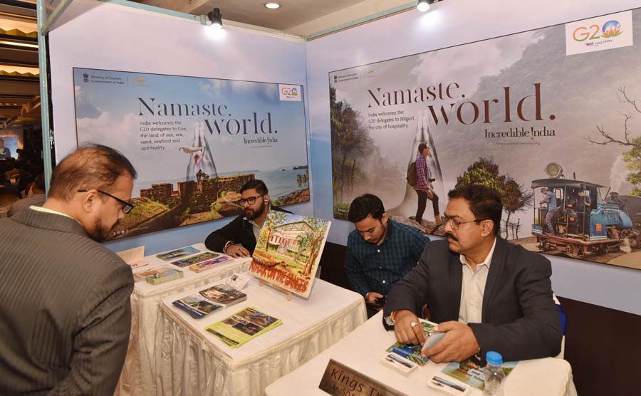 A visitor takes a look at booklets at the three-day Travel India 2023, a conference and expo on travel and tourism at The Park on Thursday