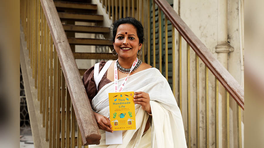 The author poses with her book