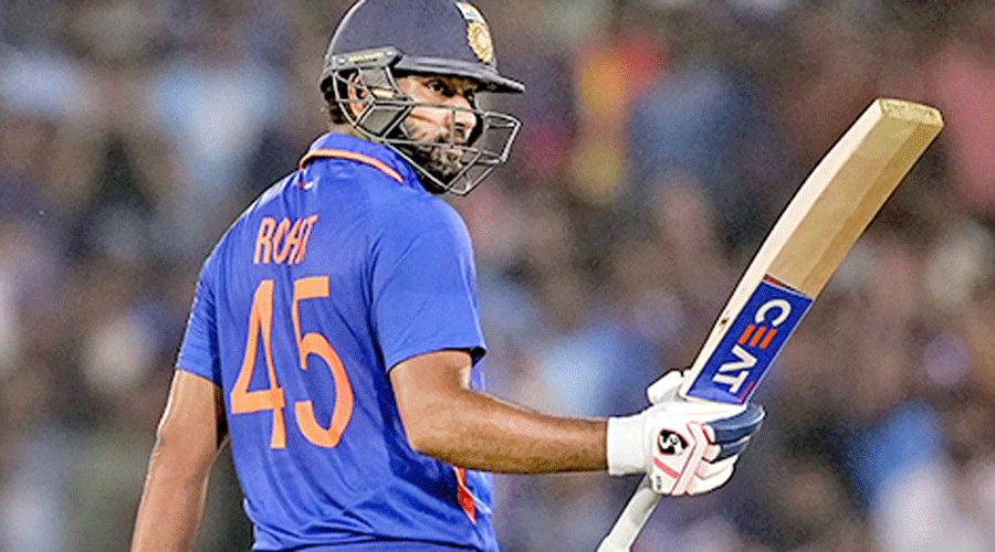 Captain Rohit Sharma celebrates after completing his half-century on Saturday.