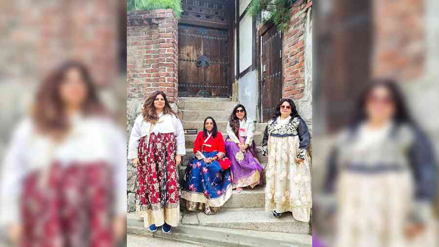The authors, Gurpreet Kaur Sethi and Vineeta Daga, and their friends dressed in hanbok, the traditional South Korean attire