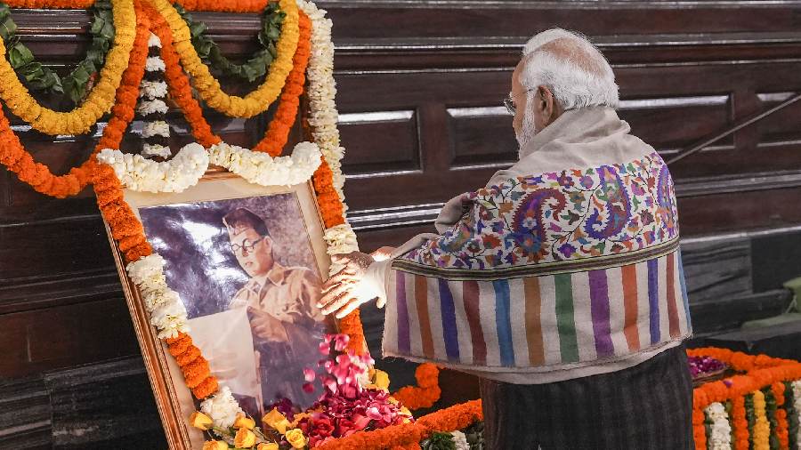 Prime Minister Narendra Modi pays floral tribute to Netaji Subhas Chandra Bose on his 126th birth anniversary, at the Central Hall of Parliament House, in New Delhi. 