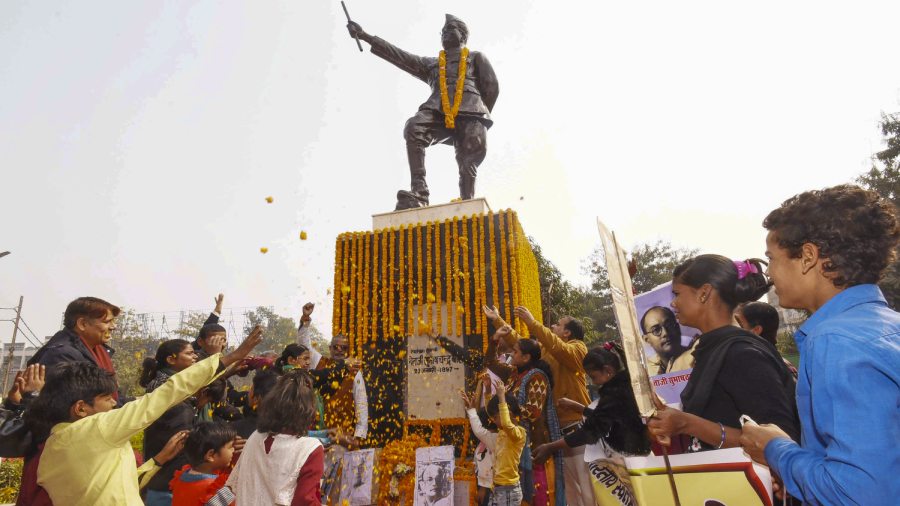 Students pay tribute to Netaji Subhas Chandra Bose on his 126th birth anniversary, in Patna. 