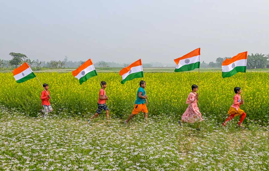 As the country gets ready to celebrate Republic Day on January 26, children were spotted running through a mustard field, carrying the Tricolour in Nadia on Monday