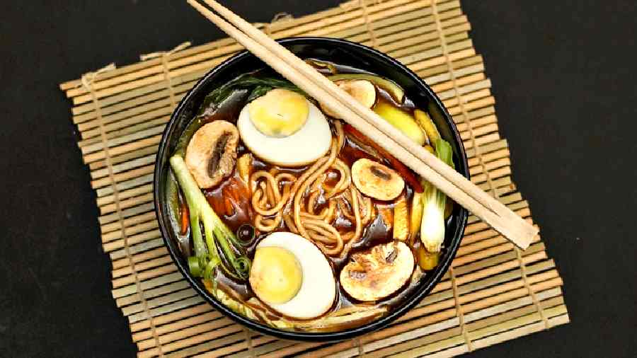 Tibetan Thukpa: Traditional Tibetan spicy noodle soup with onions, carrots, cabbage, garlic, and tomato. Comes in choice of chicken or veg. It is topped with a half-boiled egg for the non-veg variant. A hearty bowl for sure