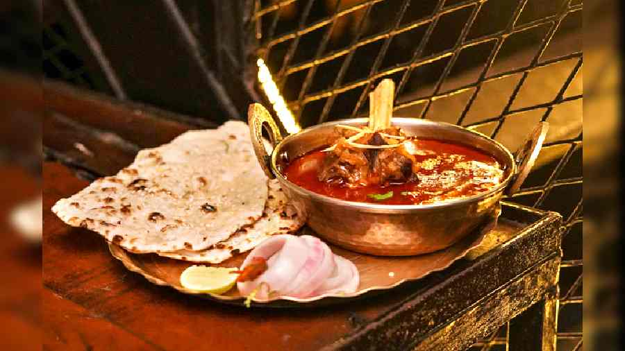 Mutton Nalli Nehari with Lamb: Lamb shank slowly cooked in traditional Awadhi spices and served with Butter Naan.