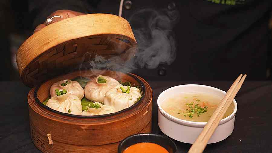 Darjeeling Street Momos: Famous street-style Tibetan dumplings stuffed with coriander, onions, chillies and chicken/ veggies like cabbage, carrots and cheese. The sauce on the side will blow your mind.