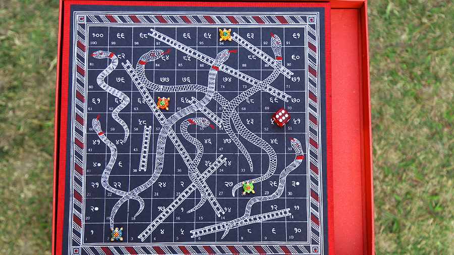 This Snakes and Ladders board game has Sanskrit as well as English numerals on it and symbolizes the ups and downs of life.