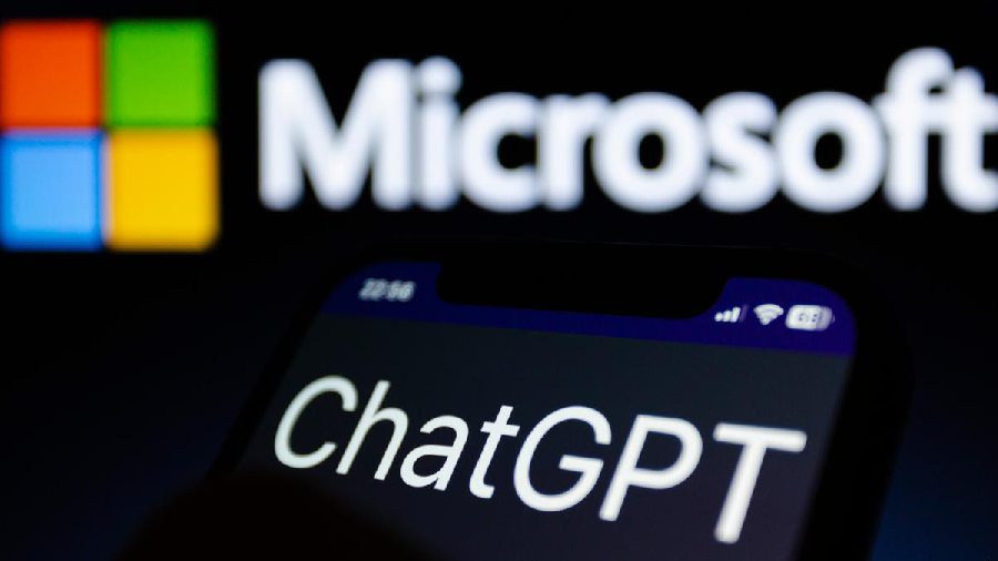 Logo of ChatGPT against the backdrop of a Microsoft logo on a bigger screen