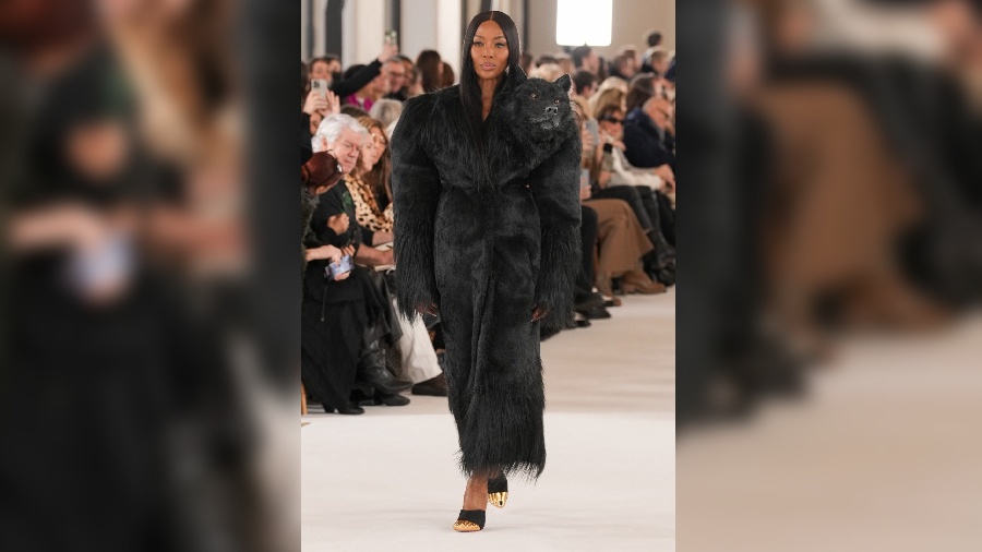 Supermodel Naomi Campbell walked the runaway wearing a fur coat dress with a wolf head attached to it. She looked fierce and iconic in the fur coat dress. 