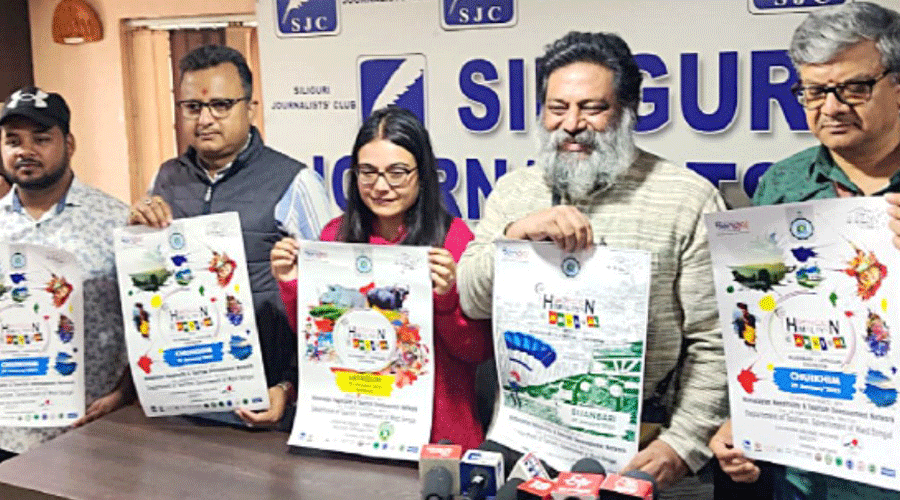 Organisers with posters of Bengal Tourism Carnival in Siliguri on Tuesday.