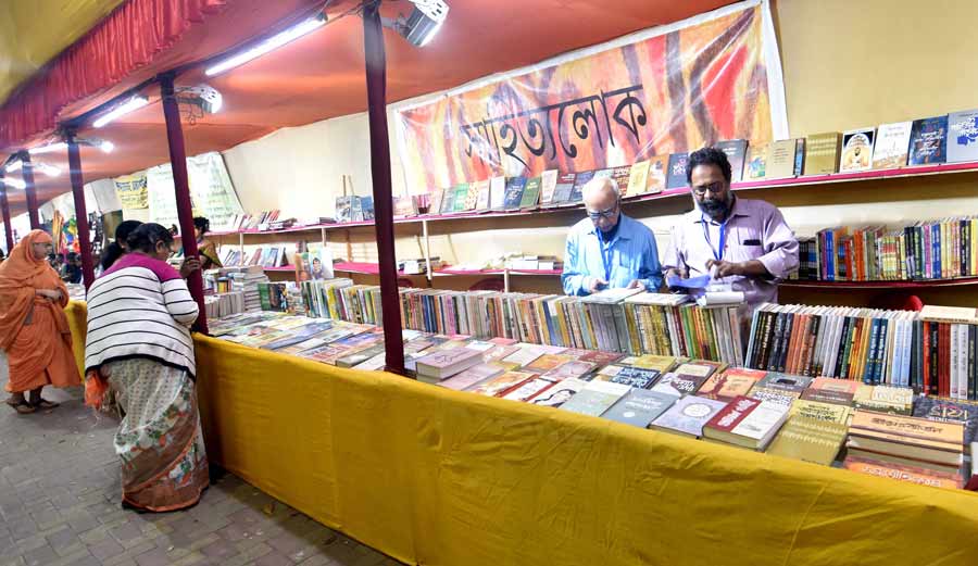 Visitors check out books on display at Nabin Sangha Boi Mela at Bagbazar