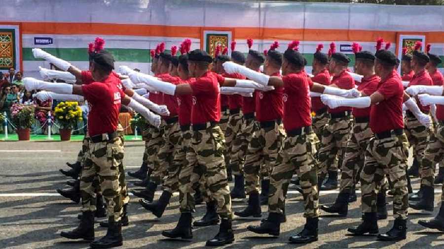A contingent marches down Red Road.