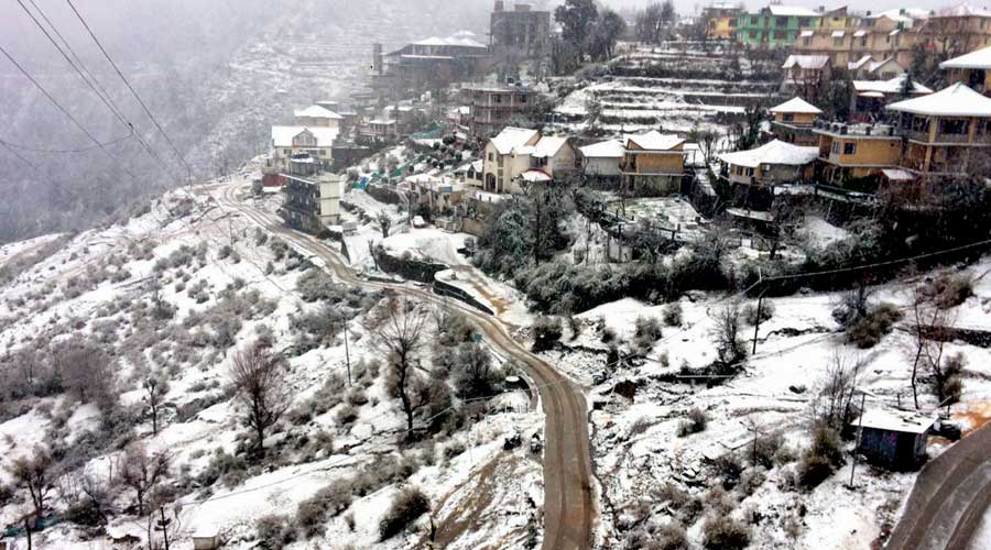 Snow-covered village after a fresh snowfall near McLeodganj in Himachal Pradesh.