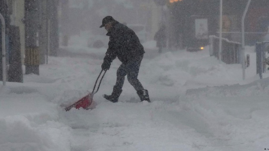 A man pictured shifting snow in Japan