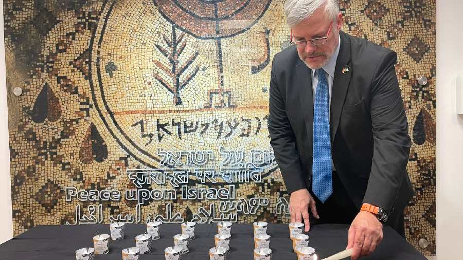 Naor Gilon (Ambassador of Israel to India, Sri Lanka and Bhutan), lights candles in the memory of Holocaust victims.