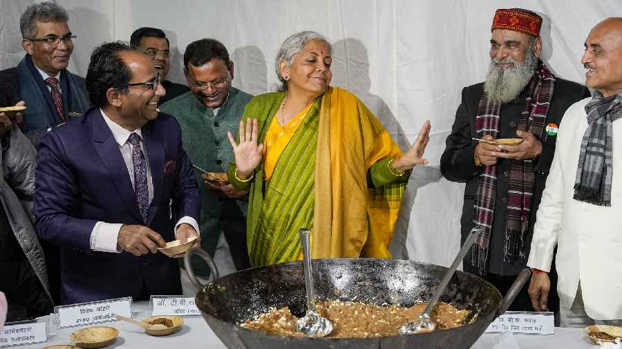 Union Finance Minister Nirmala Sitharaman with Ministers of State for Finance Bhagwat Kishanrao Karad and Pankaj Chaudhary and officials during the 'Halwa' ceremony to mark the final stage of Union Budget 2023-24, in New Delhi