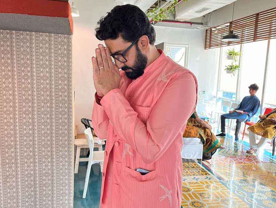 Abhishek Bachchan was clicked praying in front of the Saraswati idol. 