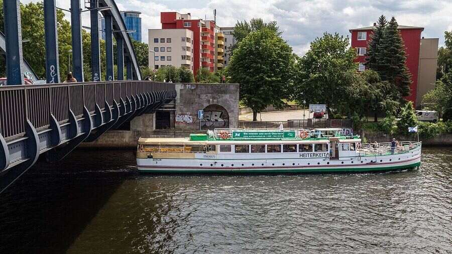 A tour boat passes underneath Charlottenbrücke on the Havel river 