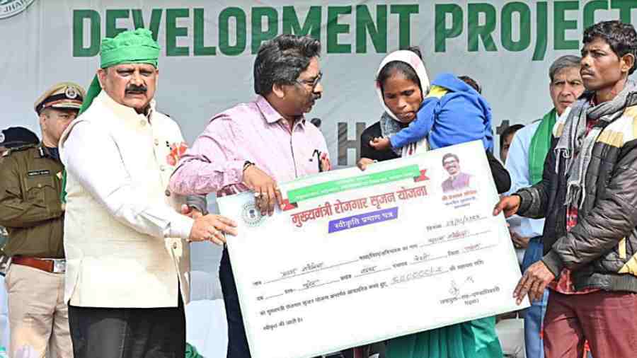 Hemant Soren distributes assets as part of government schemes to villagers at Budha Pahar on Friday.