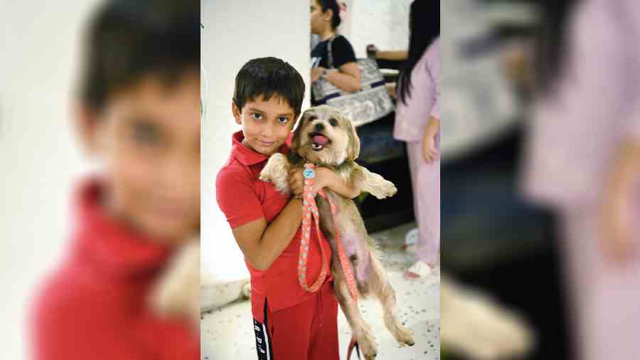 This young one was excited to pose with his pup.