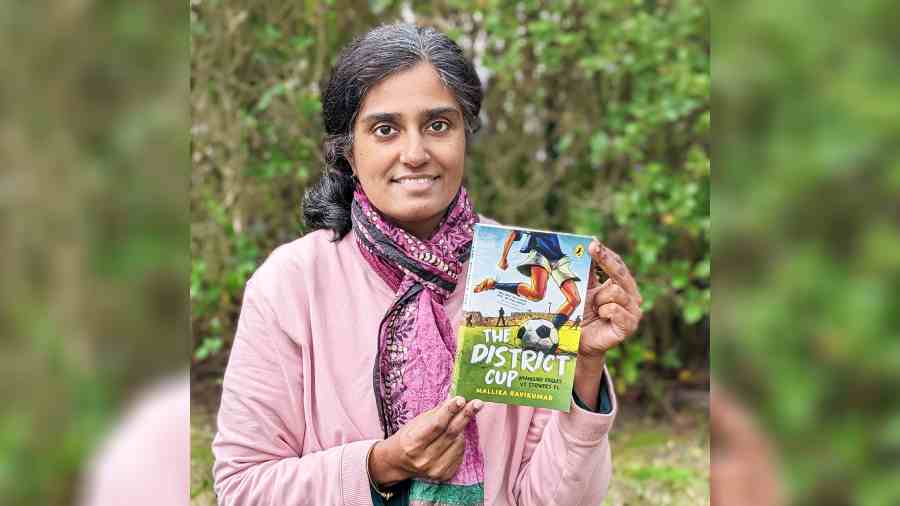 Mallika Ravikumar with her book The District Cup