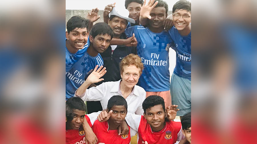 Louise Nicholson with supported SaC kids during a football training programme: 'Each year we have more and more children going to college, with ambitions to be teachers, nurses, soldiers, policemen, engineers, doctors!'