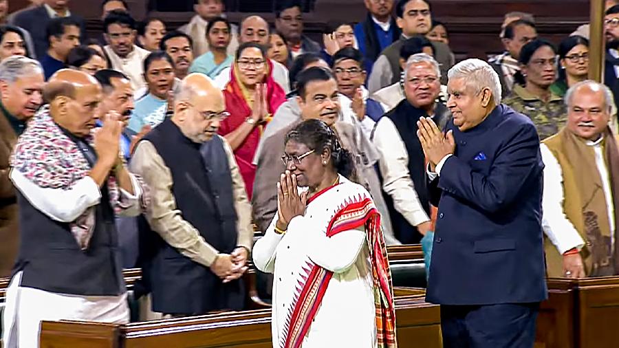 Murmu exchanges greetings with Union Ministers as she leaves after address to the joint session of Parliament on the opening day of the Budget Session.