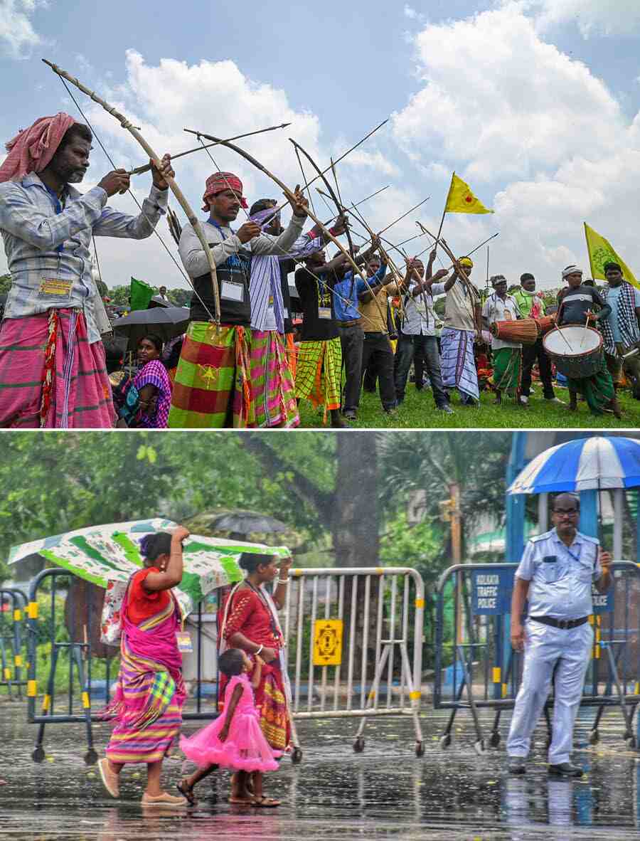 (Top) Tribal people take part in the Viswa Sarna Dharam Code Janasabha demonstration, demanding recognition of the Sarna religion, in Kolkata on Friday and (above) two tribal women and a child shield themselves from rain after a rally to mark Hul Divas at Esplanade  