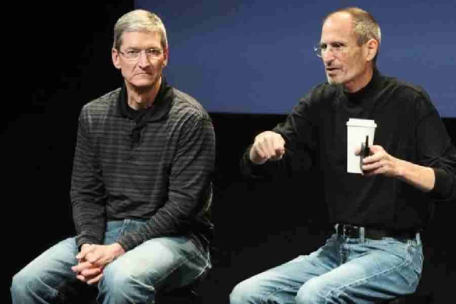 File picture of Tim Cook and Steve Jobs