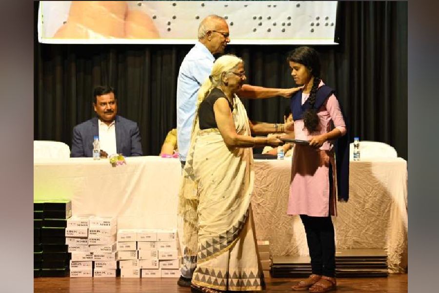 Tushar Talukdar, former commissioner of Calcutta police, and his wife Sushma felicitate students at Birla Academy on Sunday morning.