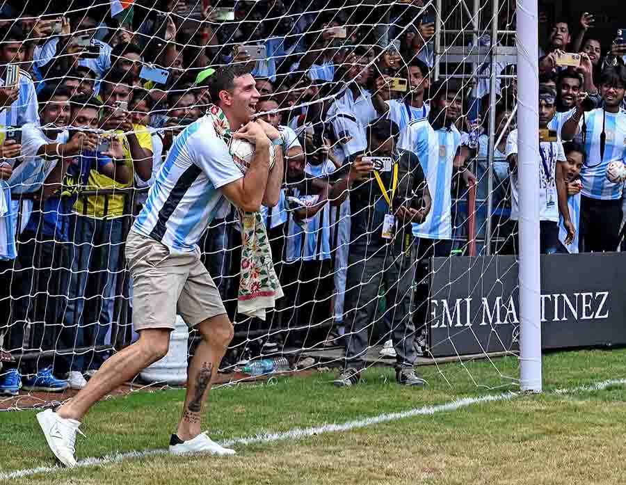 Emiliano Martinez saves a goal during an exhibition penalty shootout at the Sreebhumi Sporting Club ground after the felicitation programme.  He was also presented lifetime membership of East Bengal FC