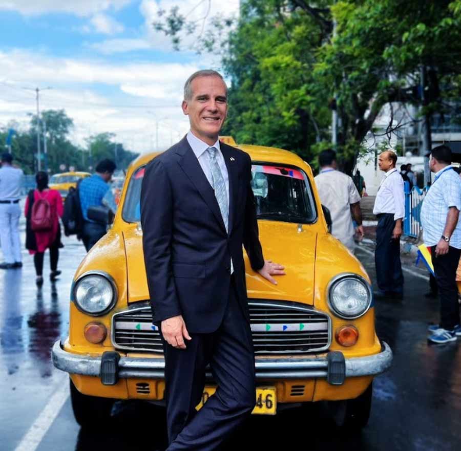US ambassador to India Eric Garcetti poses in front of a yellow cab in Kolkata on Wednesday. Garcetti is in the city for advancing US-India cooperation in the 11 states of east and Northeast India. ‘Have you seen an Ambassador with an Ambassador,’ he tweeted after taking a ride in the iconic cab  