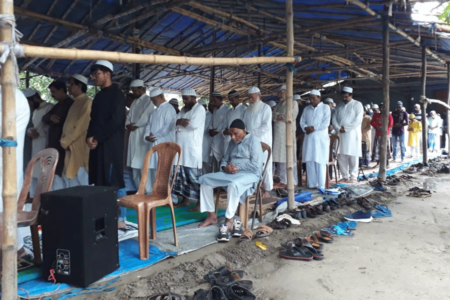 Namaaz being offered under a shade at Central Park.