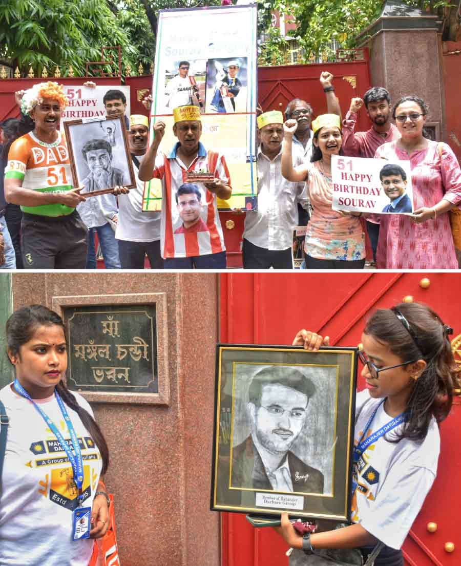 Fans assemble with posters to celebrate former Indian cricket captain Sourav Ganguly’s 51st birthday in front of his ancestral residence in Behala on Saturday