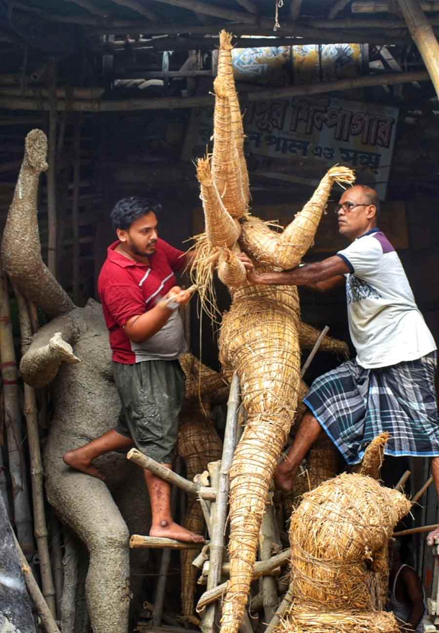 With 100 days left for Durga Puja to start, artisans at Kumartuli were busy in their work on Wednesday 