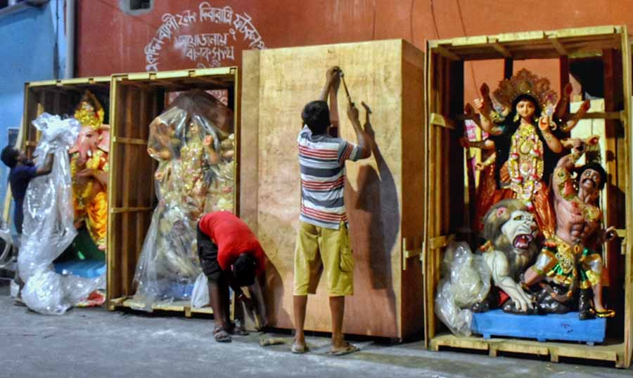 Idols of goddess Durga and her children being packed in wooden crates in Kolkata’s Kumartuli on Thursday before being shipped to foreign countries 
