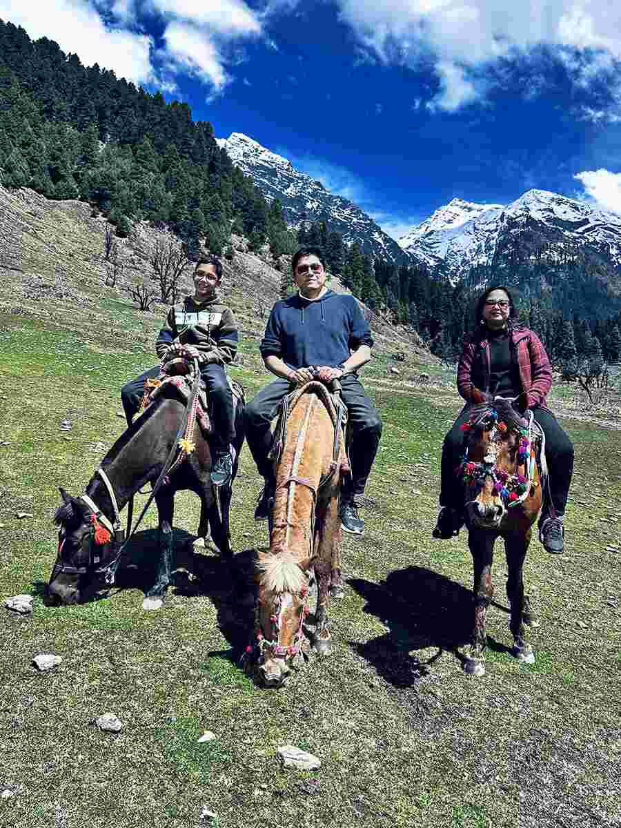 After a series of aerial sports, we finally travelled down on horseback and stopped here to take a picture. Behind us is the peak of Amarnath