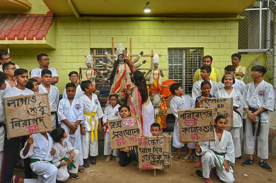 Members of Railpukur United Club, Baguiati, took out a procession on Saturday advocating the use of environment-friendly jute banners and posters during Durga Puja in West Bengal and spreading public awareness against the use of thermocol, plastic and flex by puja organisers  