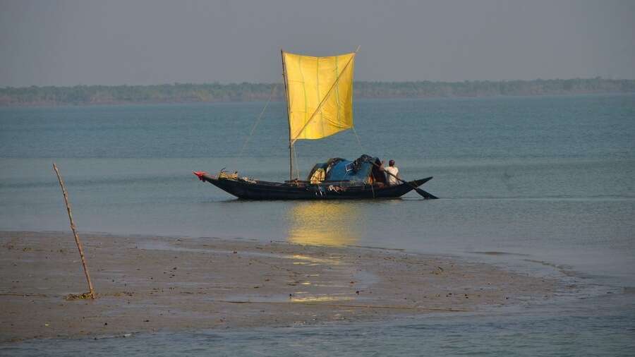 A fisherman’s boat on the water at Sunderbans. Fishermen in the area also complained that often the barges go close to the banks and, in the process, damage the fishing nets.