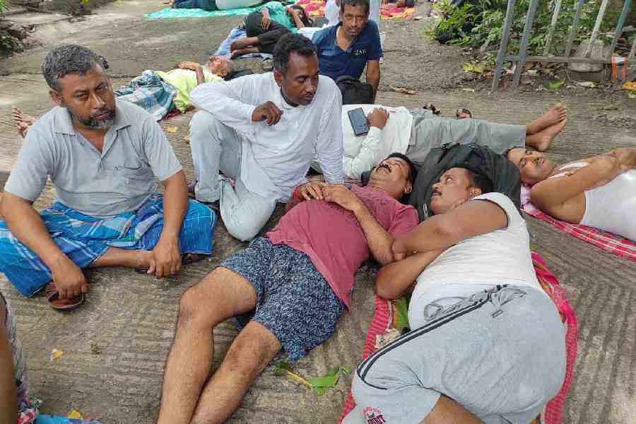 TMC worker Ashitendu Ghosh, centre (in red Tee), at the sidelines of Martyr's Day meeting.