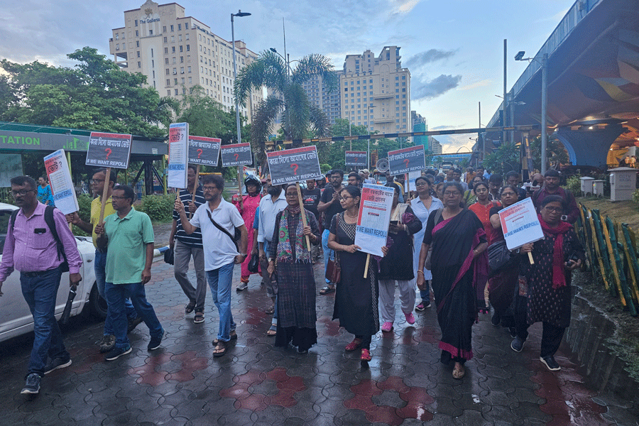 New Town residents take part in a protest march on Saturday seeking repoll after failing to cast their votes on July 8. 