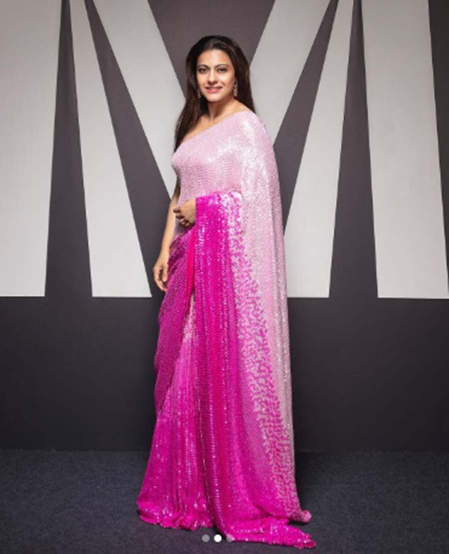 Kajol: Shimmery, shiny and sensual — when Kajol decides to go Barbiecore, she does it with a splash. And then even the fashion police sit with a pen and paper to take note. Be it a noodle-strap blouse, a halter neck one or a contrast colour full-sleeve backless choli, slip into a sari like this and go party! Psst…Don’t forget to groove on “I am a Barbie girl”