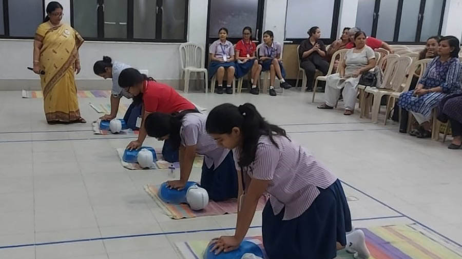 Students practising CPR on dummies at the workshop at Modern High School for Girls, Kolkata 