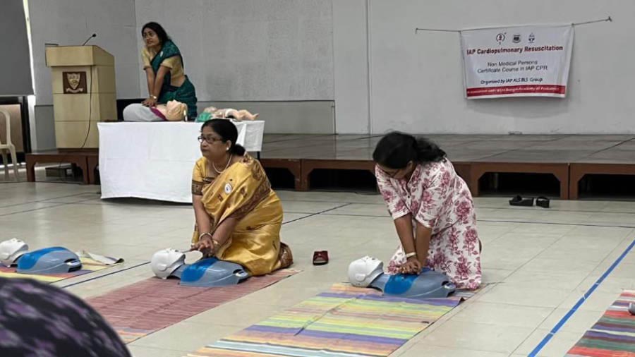 Doctors from Indian Academy of Pediatrics demonstrate the  CPR method