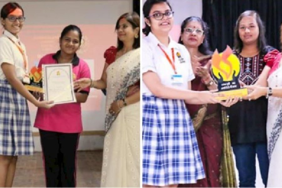 Sabina Khatun (centre) and (right) Prerana Rana (third from left) at the senior school prize day of Mahadevi Birla World Academy 