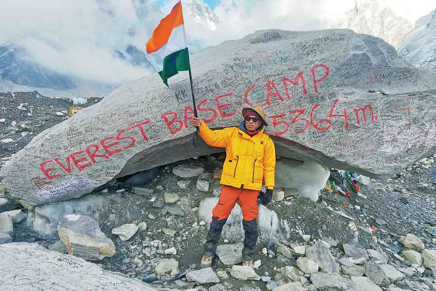 Mission accomplished: Professor Naba Kumar Mondal in front of the Everest Base Camp rock waving the Tricolour