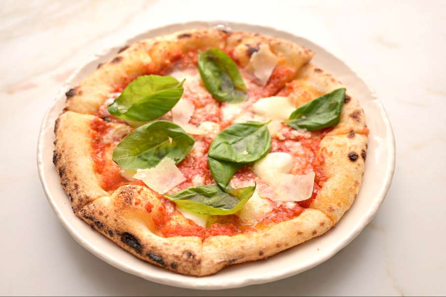 Buffalo Di Mozzarella: This simple Neapolitan-style pizza has fresh mozzarella, tomatoes and fresh basil for that easy Italian taste.