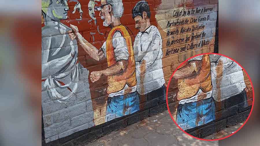 Gutkha stains spoil a graffiti on a Strand Road wall. 