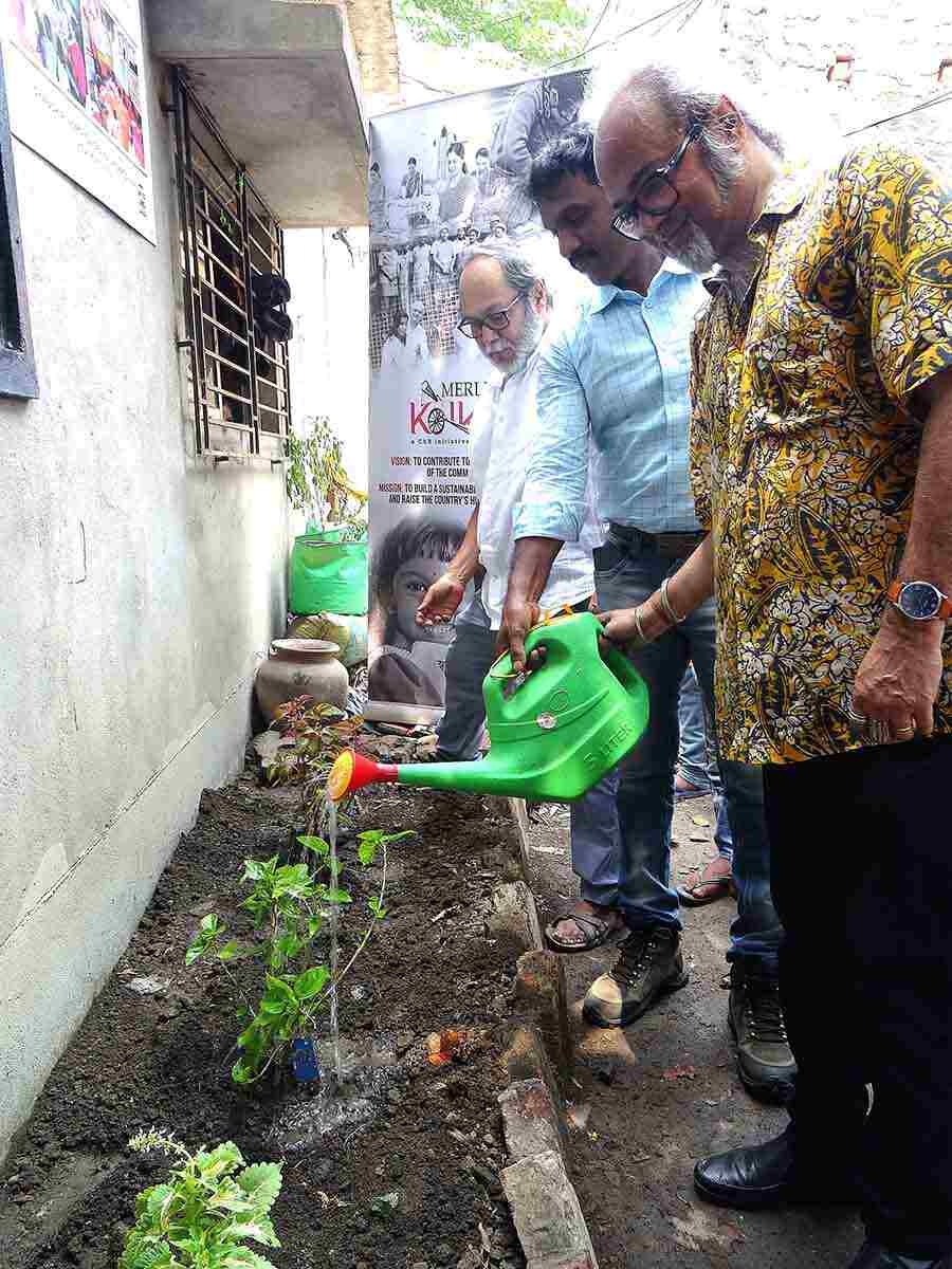 Soumitra Roy from Bhoomi enjoyed watering the plants and being close to nature.  The guests, including West Bengal government chief environment officer K. Balamurugan and Bhoomi singer Soumitra Roy, participated in a plantation drive and gifted the children saplings.  The event was also attended by Sugata Hazra, former professor of oceanographic studies at Jadavpur University; and Sarbani Bhattacharya, vice-president of corporate communications and CSR at Merlin Group.  ‘It is crucial to educate children about the pressing issues of climate change. They are the future of our nation and they need to learn measures to add to the green movement. Together we can tackle  the issues of global warming and plastic waste management,’ said Saket Mohta, managing director, Merlin Group.  Ashish Ghosh, regional coordinator (Asia) of Terre des Hommes Suisse added, ‘This collaboration will allow us to take a concrete step towards the achievement of education for sustainable development of the most marginalised children of urban slums in Kolkata.’